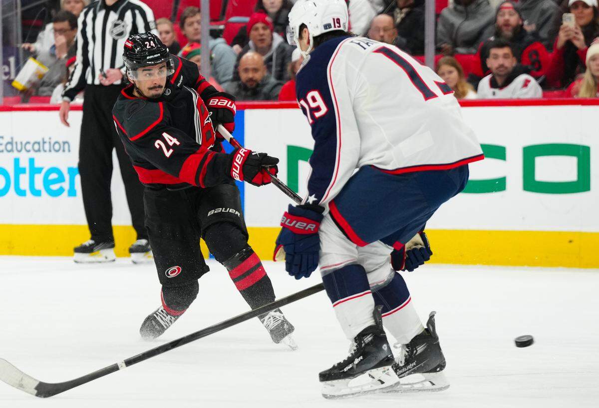 Carolina Hurricanes center Seth Jarvis (24) shoots against the Columbus Blue Jackets during the first period at Lenovo Center.