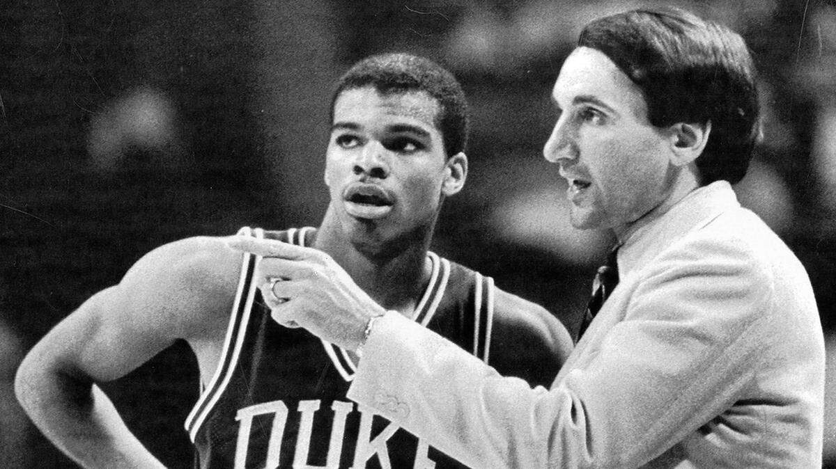 Duke coach Mike Krzyzewski gives instructions to his team, including point guard Tommy Amaker, during the Blue Devils’ game against Maryland in the 1985 ACC Tournament in Atlanta, Georgia.