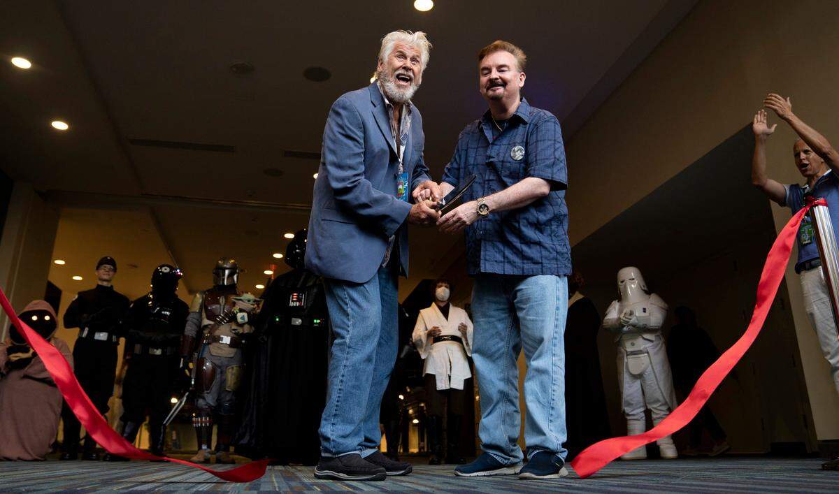Barry Bostwick and Brian O’Halloran cut the ribbon to commemorate the start of the annual GalaxyCon on Thursday, July 28, 2022 in Raleigh, N.C. at the Raleigh Convention Center.