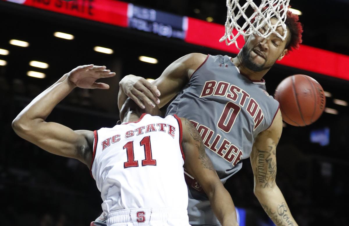 Boston College's Ky Bowman (0) blocks the shot by N.C. State's Markell Johnson (11) during the first half of N.C. State's game against Boston College in the second round the 2018 New York Life ACC Tournament at the Barclays Center in Brooklyn, N.Y., Wednesday, March 7, 2018.