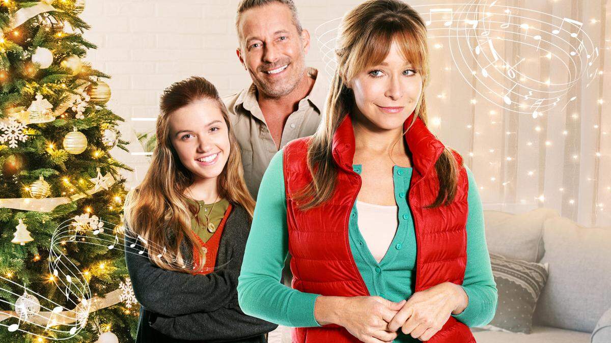 (L-R): Madeline Grace, Johnny Messner and Jamie Luner in the Lifetime movie “The Christmas High Note.”