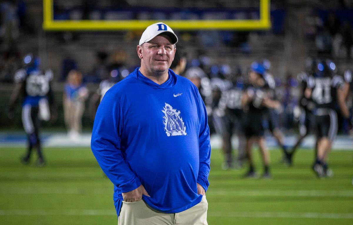 Duke coach Mike Elko watches the North Carolina players warm up prior to their game on Saturday, October 15, 2022 at Wallace-Wade Stadium in Durham, N.C.
