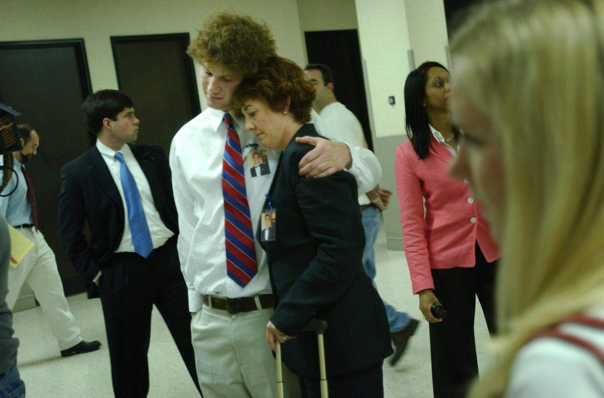 Terrie Myers and Steve Cox take a moment after Larry Robert Veeder Jr. was sentenced April 23, 2004, the Wake County Courthouse. Veeder was sentenced from eight years, six month to 10 years, eight months for killing six people, including Nolan Myers, Terrie's son and Steve's best friend, after Veeder drove into them drunk November 1, 2003.