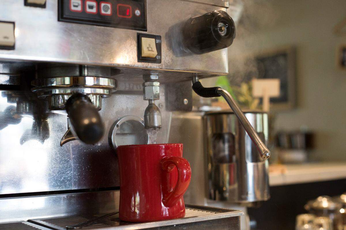 Steam rises from a mug at Sola Coffee Cafe in Raleigh as barista Jennifer Hall makes tea on Tuesday, July 15, 2014. Sola Coffee Cafe is a member of the Greater Raleigh Merchants Alliance and its Shop Local Raleigh campaign, which promotes and supports locally-owned, independent businesses.