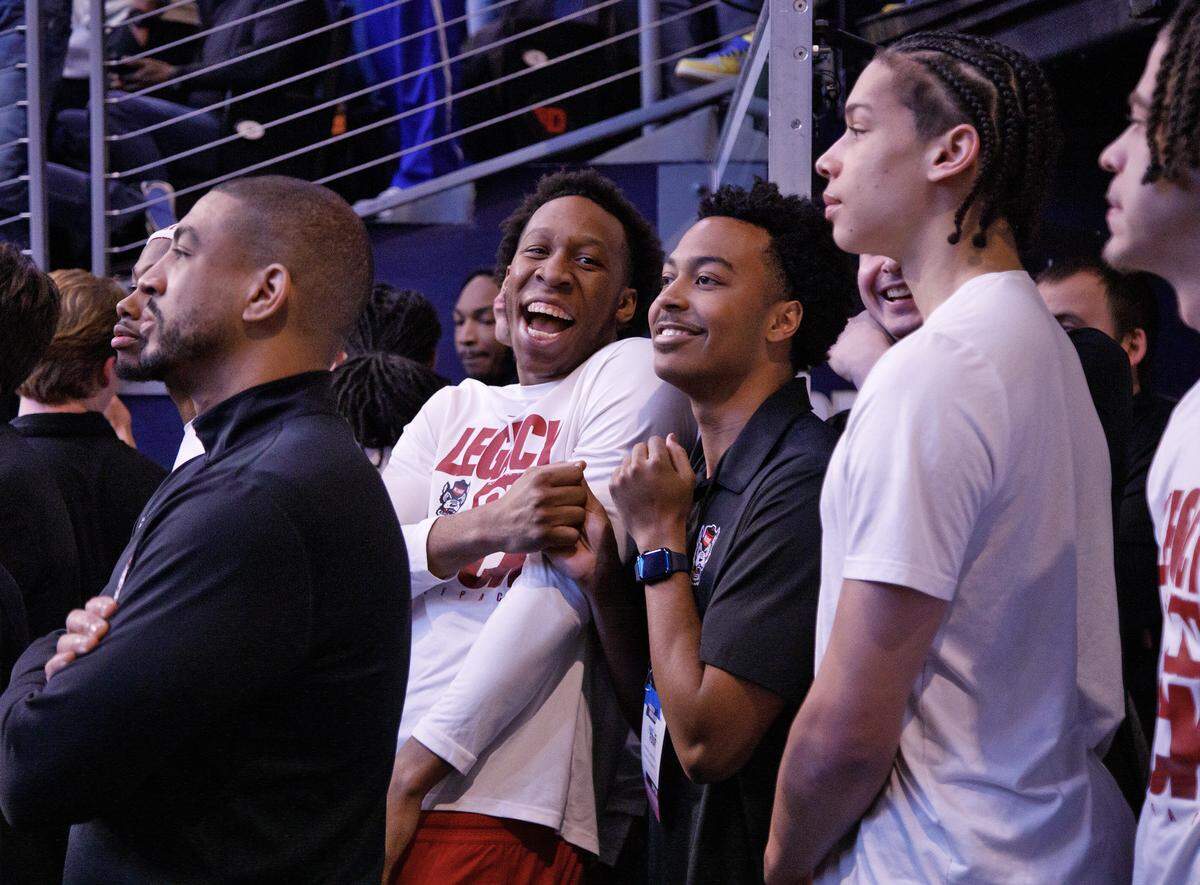N.C. State’s Quadir Copeland, second from left, smiles as the team waits to take the court prior to the Wolfpack’s game against Texas in the NCAA First Four on Tuesday, March 17, 2026, at the University of Dayton Arena in Dayton, Ohio. 