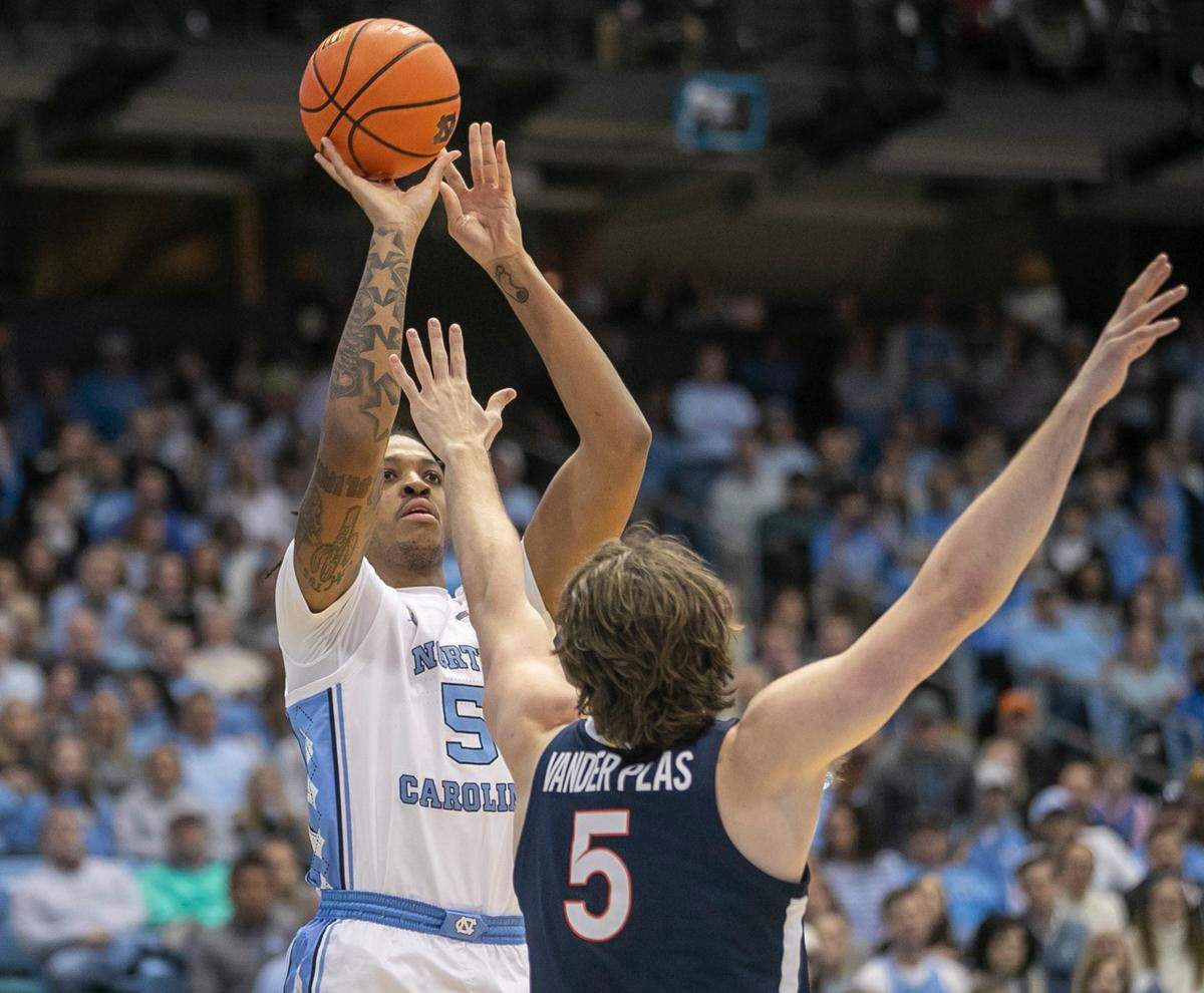North Carolina’s Armando Bacot (5) puts up a shot against Virginia’s Ben Vander Plas (5) in the first half against Virginia on Saturday, February 25, 2023 at the Smith Center in Chapel Hill, N.C.