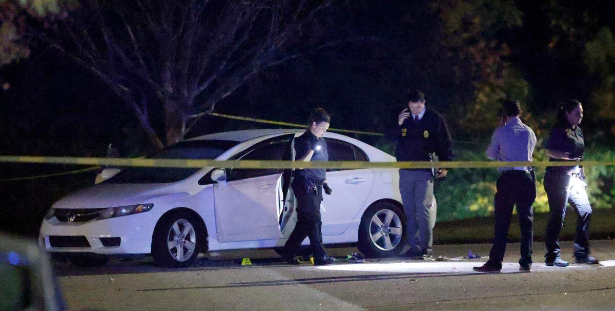 Police work the scene on Osprey Cove Drive in the Hedingham neighborhood in Raleigh, N.C., Thursday evening, Oct. 13, 2022.