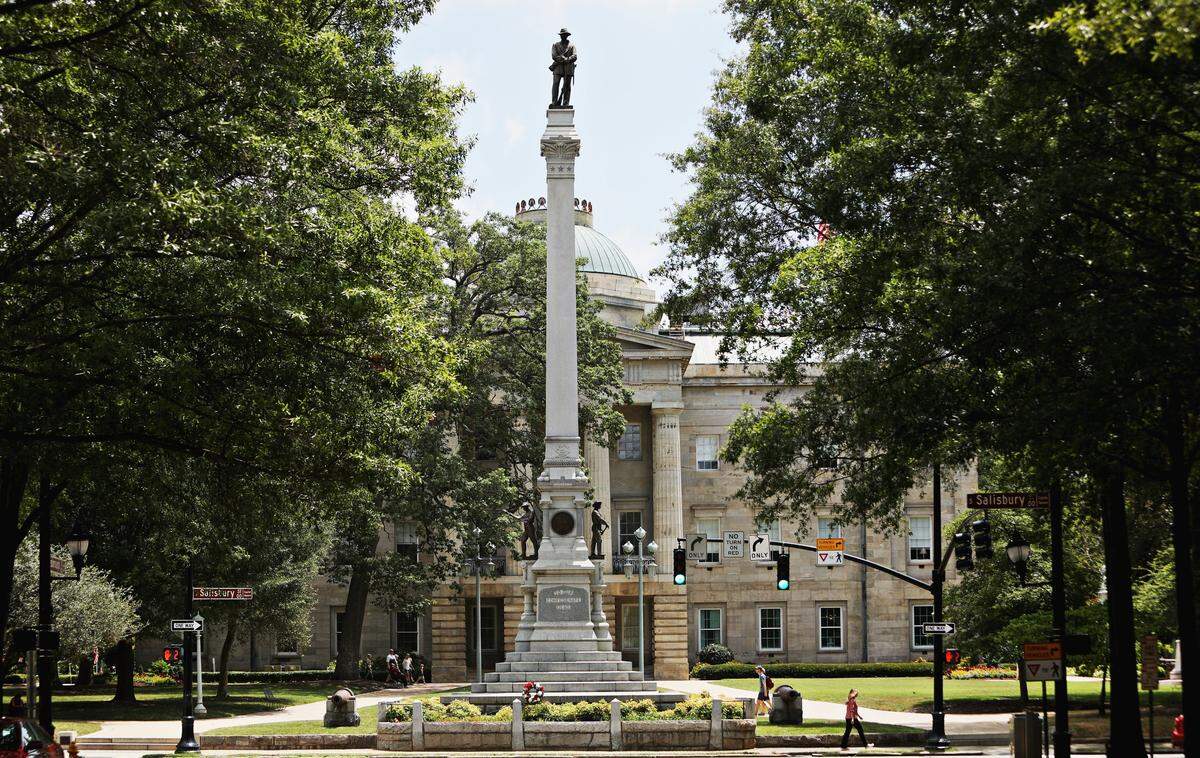 At 75 feet high, the Confederate Soldiers Monument is the tallest monument on the Capitol grounds. A Confederate soldier statue tops an obelisk. On two sides of the base, two more Confederate soldiers statues stand. Below that are two cannons. The monument is close to the sidewalk, easily viewable from Hillsborough Street before it dead ends at the Capitol. It was dedicated May 20, 1895.