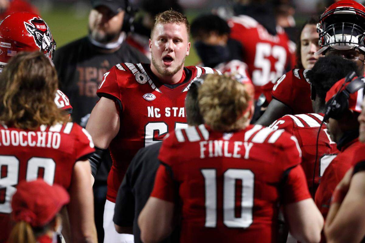 N.C. State offensive tackle Justin Witt (67) encourages the offense during the second half of N.C. State’s 15-14 victory over Liberty at Carter-Finley Stadium in Raleigh, N.C., Saturday, Nov. 21, 2020.