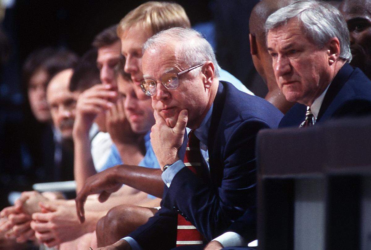 UNC assistant coach Bill Guthridge  on the bench beside head coach Dean Smith during a 1997 game.  Guthridge took the helm after Smith retired.