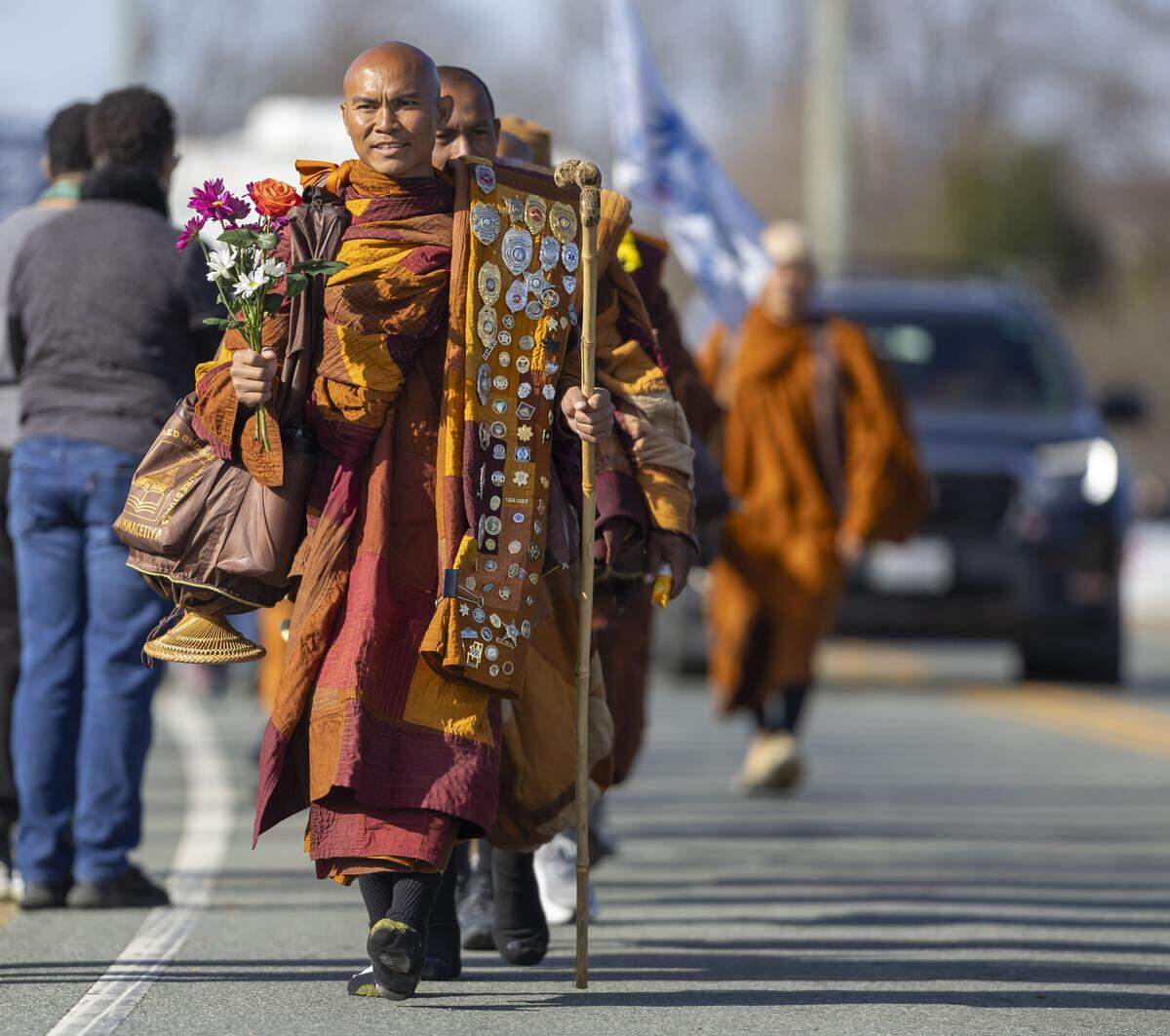 Buddhist monks traverse S. Greensboro Street during the Walk for Peace on Jan. 21 in Liberty, North Carolina.