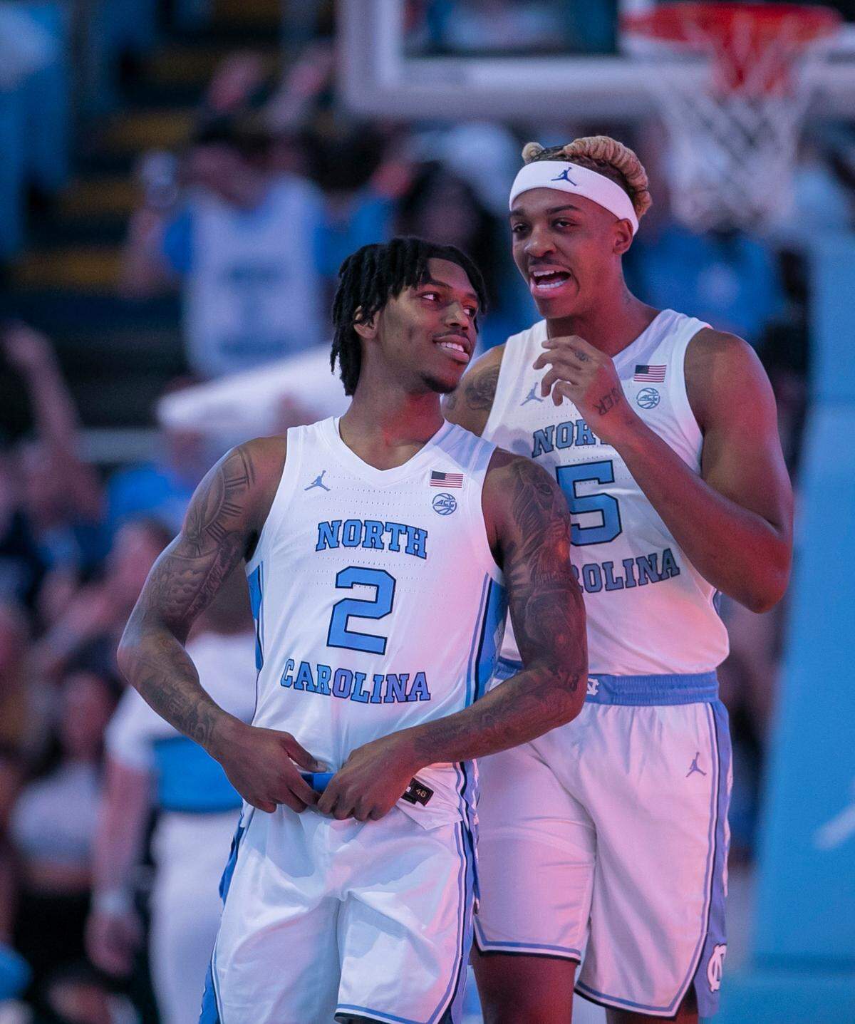 North Carolina’s Armando Bacot (5) has a word with Caleb Love (2) and they prepare to tip off against UNC Wilmington on Monday, November 7, 2022 at the Smith Center in Chapel Hill, N.C.