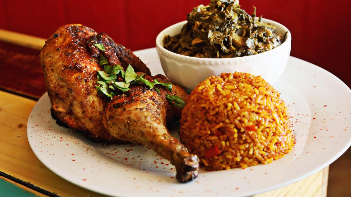 Zweli’s in Durham serves a half chicken with a side of collard greens cooked with peanut butter and Jollof rice. The owners will open a second restaurant, Zweli’a Ekhaya, next year in the American Tobacco Campus.