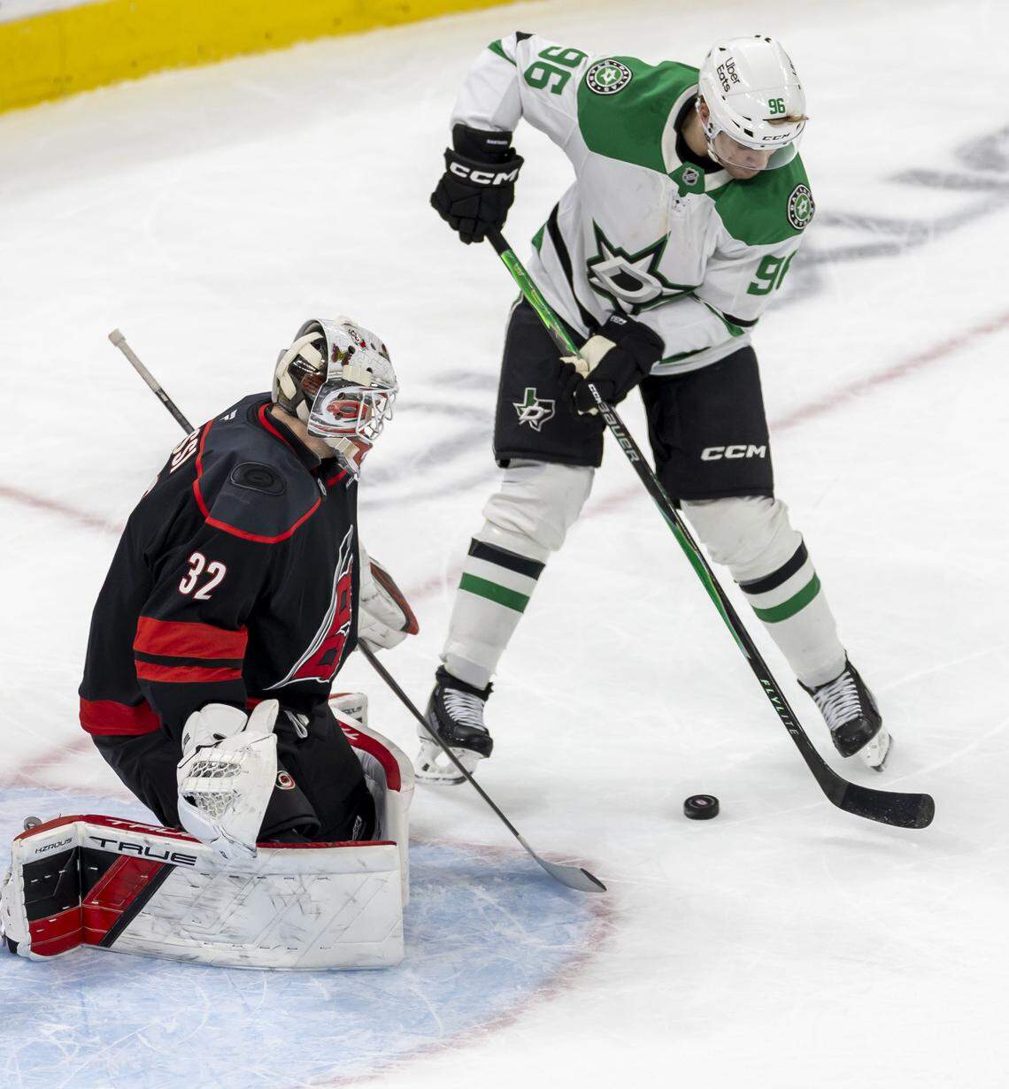 Carolina Hurricanes goalie Brandon Bussi (32) stops a scoring attempt by Dallas right wing Mikko Rantanen (96) in the second period on Tuesday, January 6, 2026 at Lenovo Center in Raleigh, N.C.