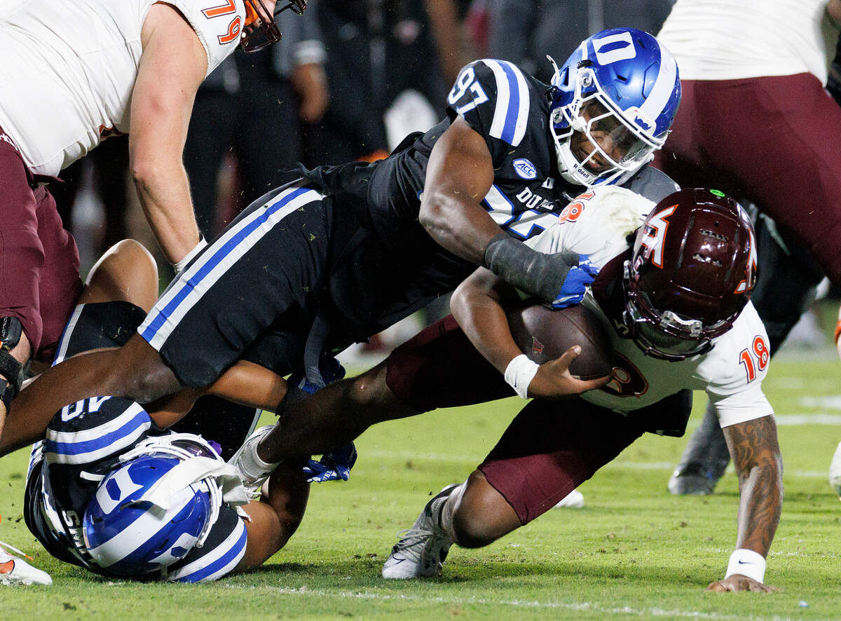 Duke’s Wesley Williams sacks Virginia Tech quarterback William Watson III during the first half of the Blue Devils’ game on Saturday, Nov. 23, 2024, at Wallace Wade Stadium in Durham, N.C.