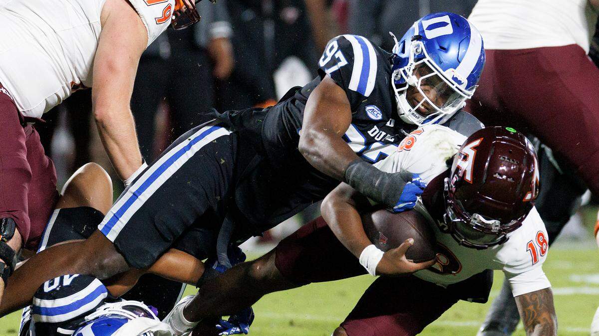 Duke’s Wesley Williams sacks Virginia Tech quarterback William Watson III during the first half of the Blue Devils’ game on Saturday, Nov. 23, 2024, at Wallace Wade Stadium in Durham, N.C.