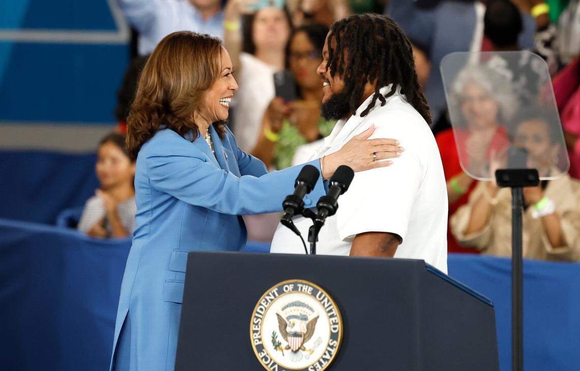 Vice President and Democratic nominee for president Kamala Harris greets Mike De Los Santos, owner of Mike D’s BBQ in Durham, before speaking at Wake Tech Community College’s North Campus in Raleigh, N.C., Friday, August 16, 2024.