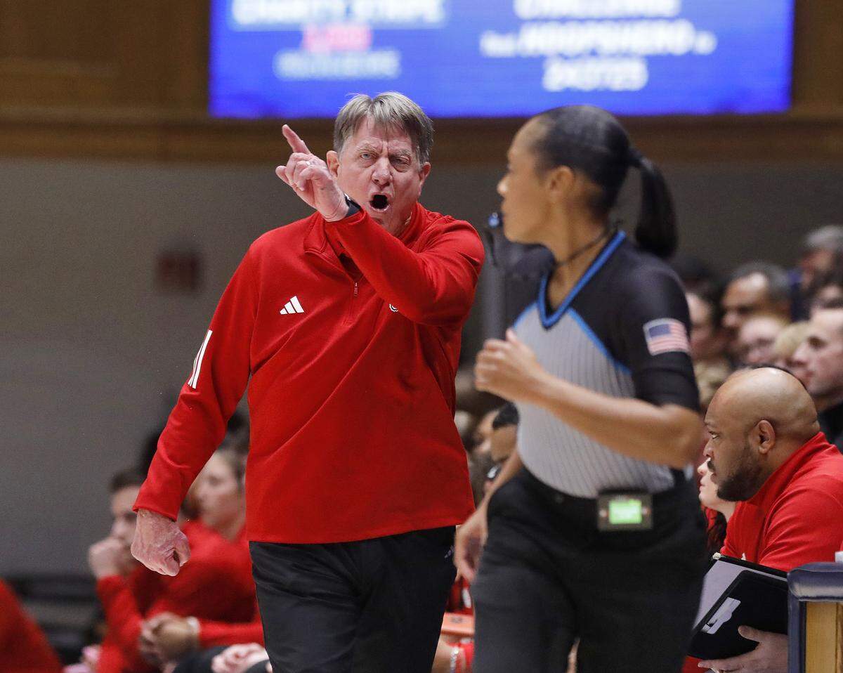 N.C. State head coach Wes Moore speaks to an official during the first half of the Wolfpack’s 83-65 loss to Duke on Thursday, Feb. 19, 2026, at Cameron Indoor Stadium in Durham, N.C.