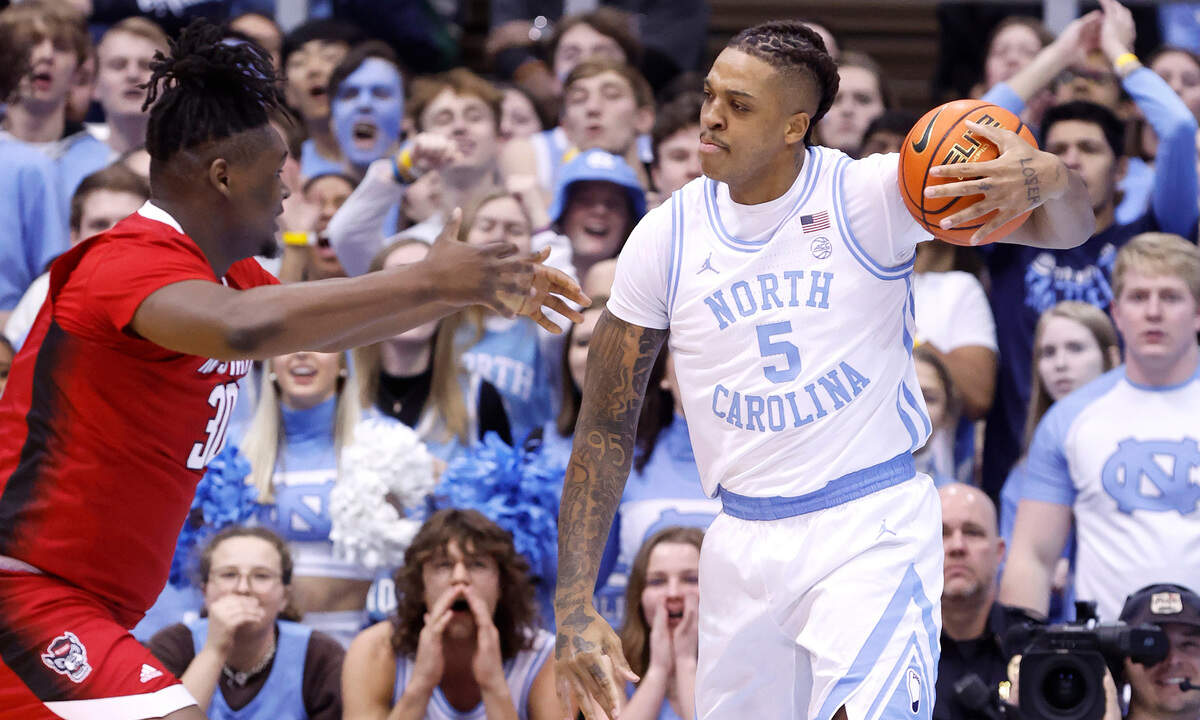 North Carolina’s Armando Bacot (5) looks at N.C. State’s D.J. Burns Jr. (30) after stealing the ball from him during the first half of N.C. State’s game against UNC at the Smith Center in Chapel Hill, N.C., Saturday, Jan. 21, 2023.