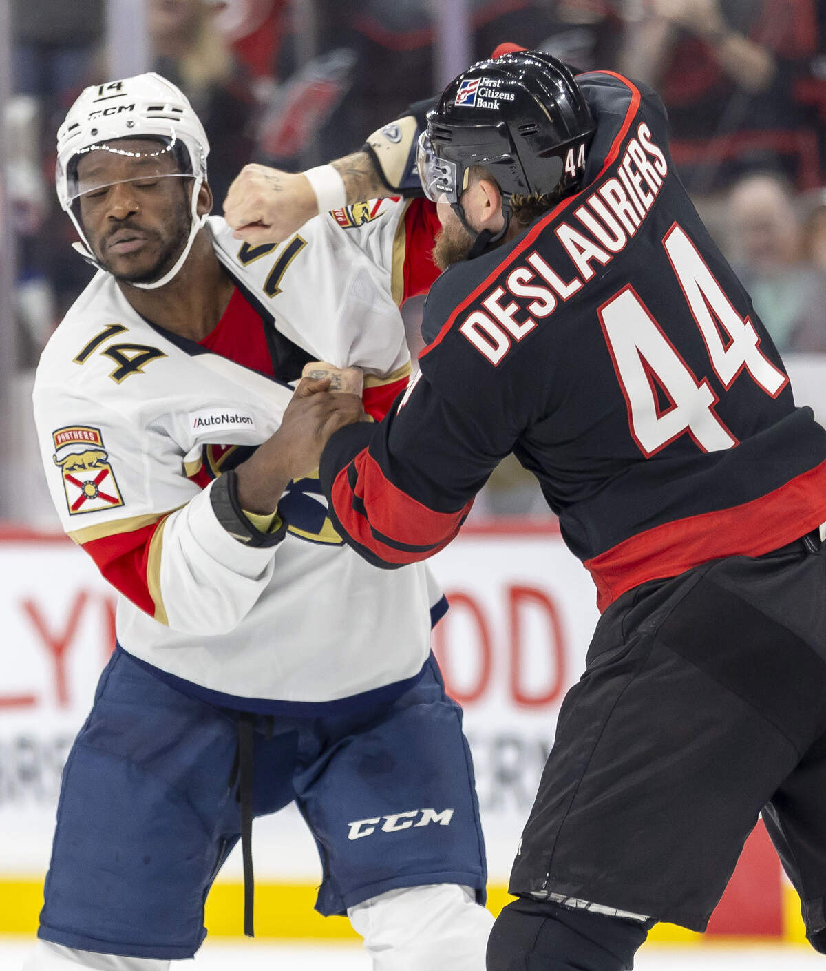 Carolina Hurricanes left wing Nicolas Deslauriers (44) drops the gloves for a fight with Florida Panthers left wing Bokondji Imama (14) in the first period on Tuesday, Sept. 29, 2026, at Lenovo Center in Raleigh, N.C.
