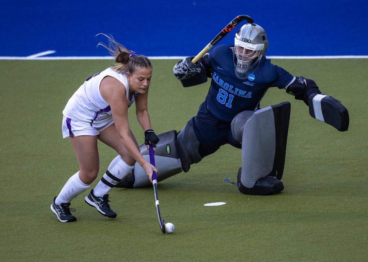 North Carolina goalie Maddie Kahn (81) defends Northwestern’s (6) Peyton Halsey in the sudden death shootout during the NCAA Division I Field Hockey Championship on Sunday, November 19, 2023 at Karen Shelton Stadium in Chapel Hill, N.C. Kahn was selected the MVP of the Championship.