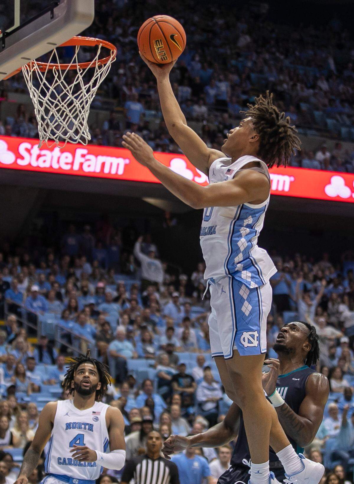 North Carolina’s Seth Trimble (0)) breaks to the basket against UNC Wilmington’s Victor Enoh (12) in the second half on Monday, November 7, 2022 at the Smith Center in Chapel Hill, N.C.