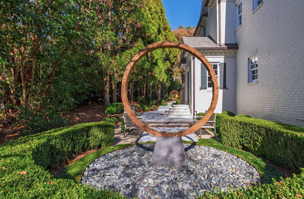 An original sculpture by Raleigh-based artist Thomas Sayer is included in the listing at 445 Drummond Drive in Raleigh.