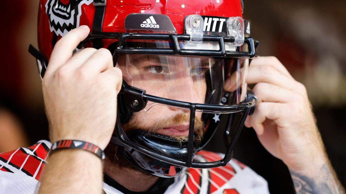 N.C. State quarterback Devin Leary (13) gets ready to head out onto the field to warmup before N.C. State’s game against Clemson at Memorial Stadium in Clemson, S.C., Saturday, Oct. 1, 2022.