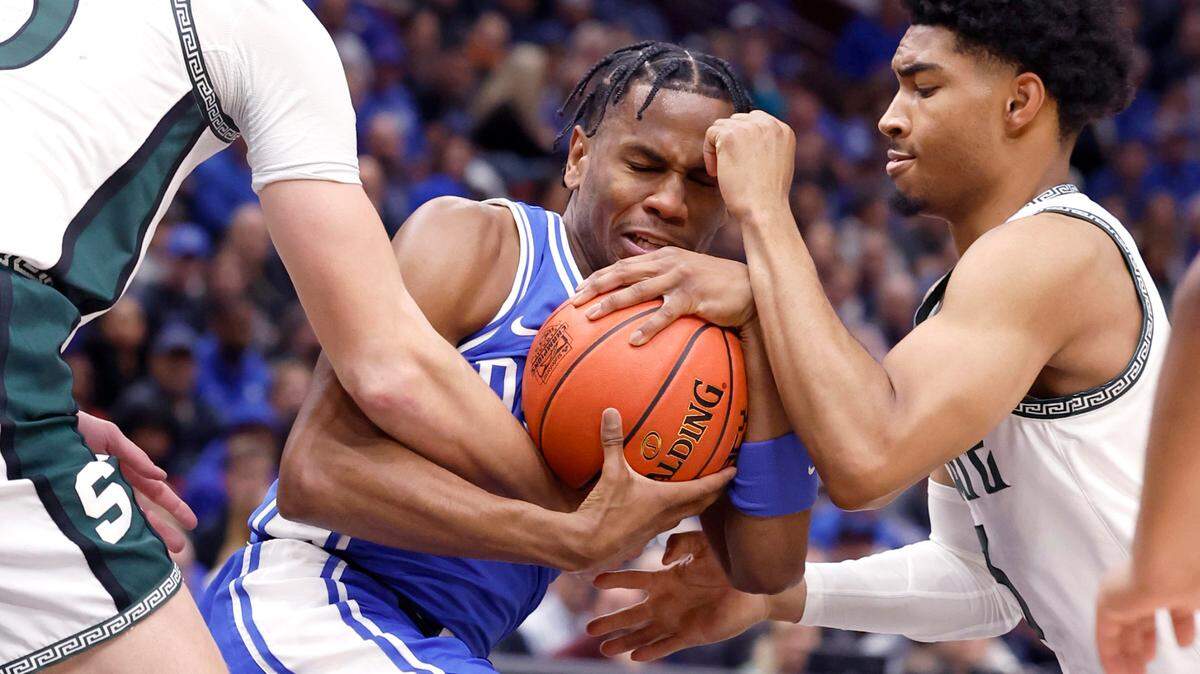 Duke’s Jeremy Roach (3) is pressured by Michigan State’s Carson Cooper (15) and Jaden Akins (3) during the first half of Duke’s game against Michigan State in the Champions Classic at the United Center in Chicago, IL, Tuesday, Nov. 14, 2023.