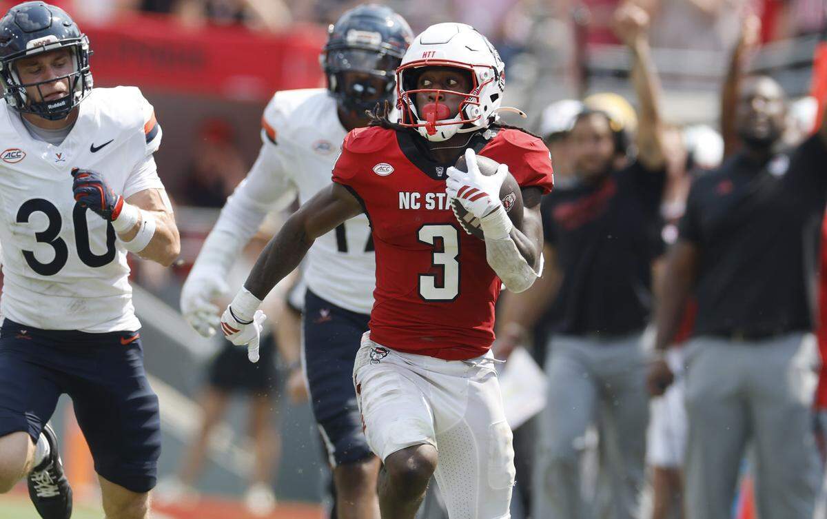 N.C. State running back Hollywood Smothers (3) scrambles for 57 yards during the second half of N.C. State’s 35-31 victory over Virginia at Carter-Finley Stadium in Raleigh, N.C., Sat. Sept. 6, 2025.
