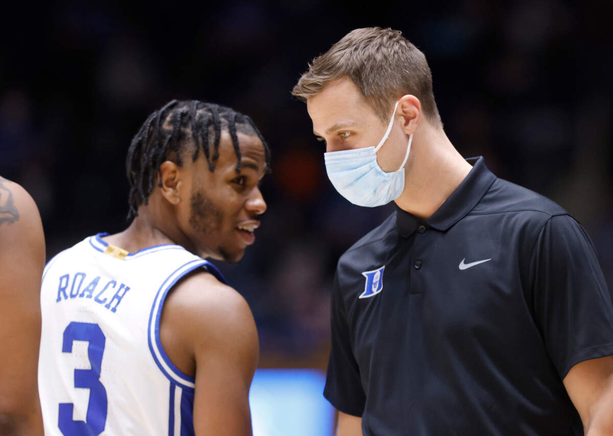 Associate head coach Jon Scheyer talks with Jeremy Roach (3) during the second half of Duke’s 69-57 victory over Georgia Tech at Cameron Indoor Stadium in Durham, N.C., Tuesday, January 4, 2022.
