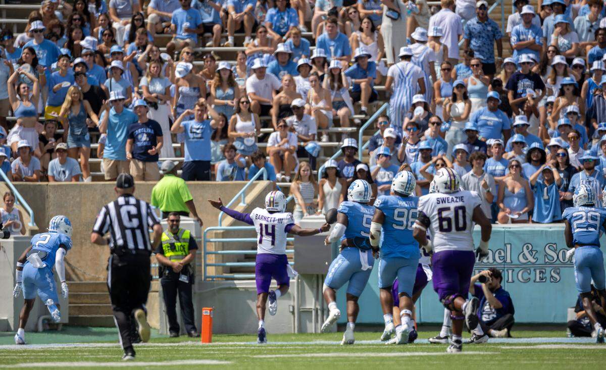 James Madison quarterback Alonza Barnett III, scores on a 27-yard run to take a 46-21 lead over North Carolina in the second quarter on Saturday, September 21, 2024 at Kenan Stadium in Chapel Hill, N.C.