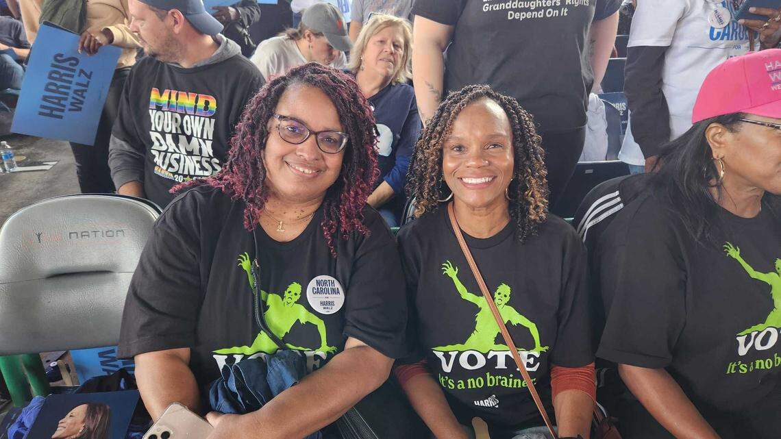 Cindy Johnson, left, and Tracey Wilcox, right, attended Vice President Kamala Harris’ campaign rally for president on Wednesday, Oct. 30, 2024 at Coastal Credit Union Music Park at Walnut Creek in Raleigh.