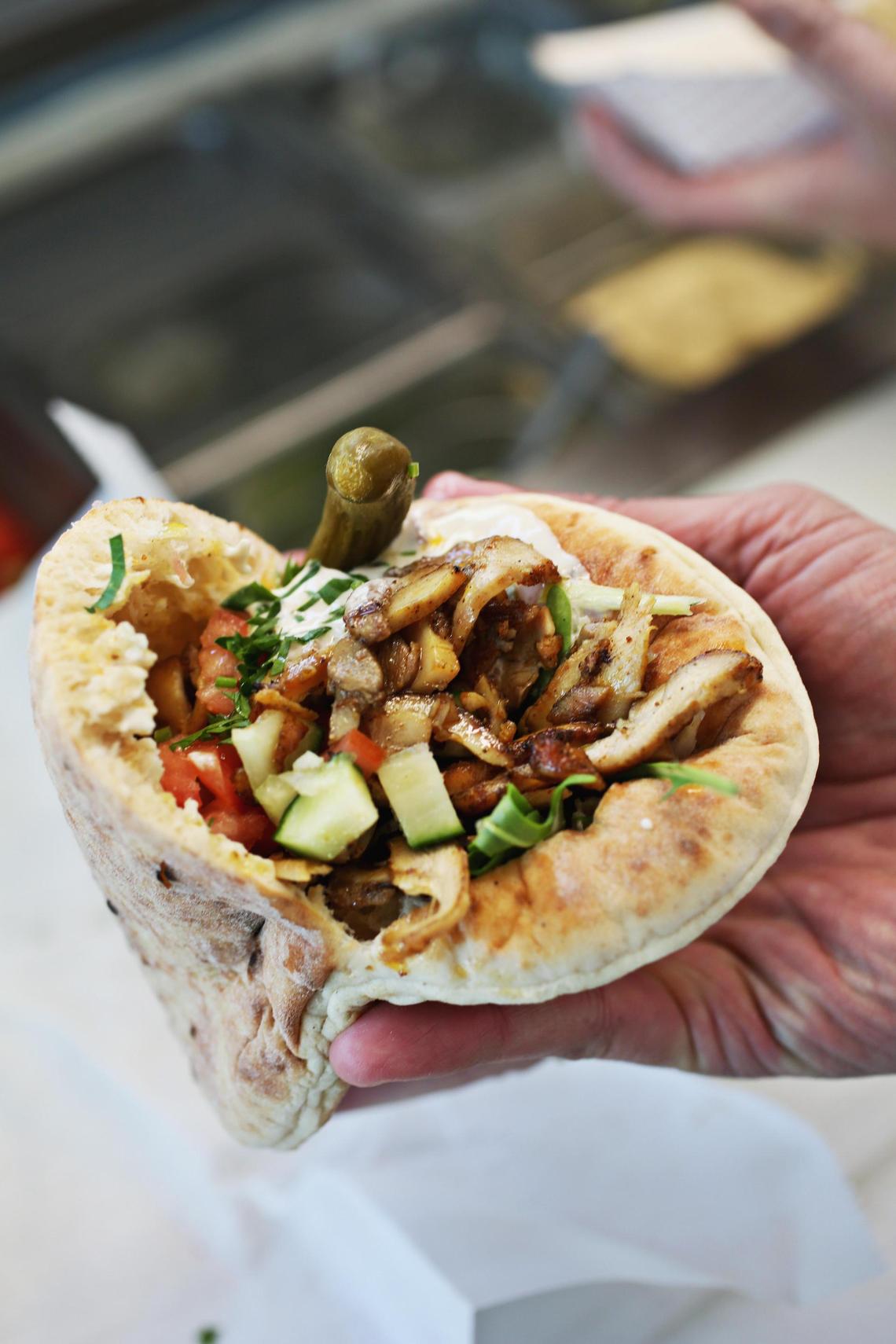 The Chicken Shawarma from Soomsoom Pita Pockets food truck is made up of 12 spice chicken with grilled onions, fresh vegetables, and tahini.