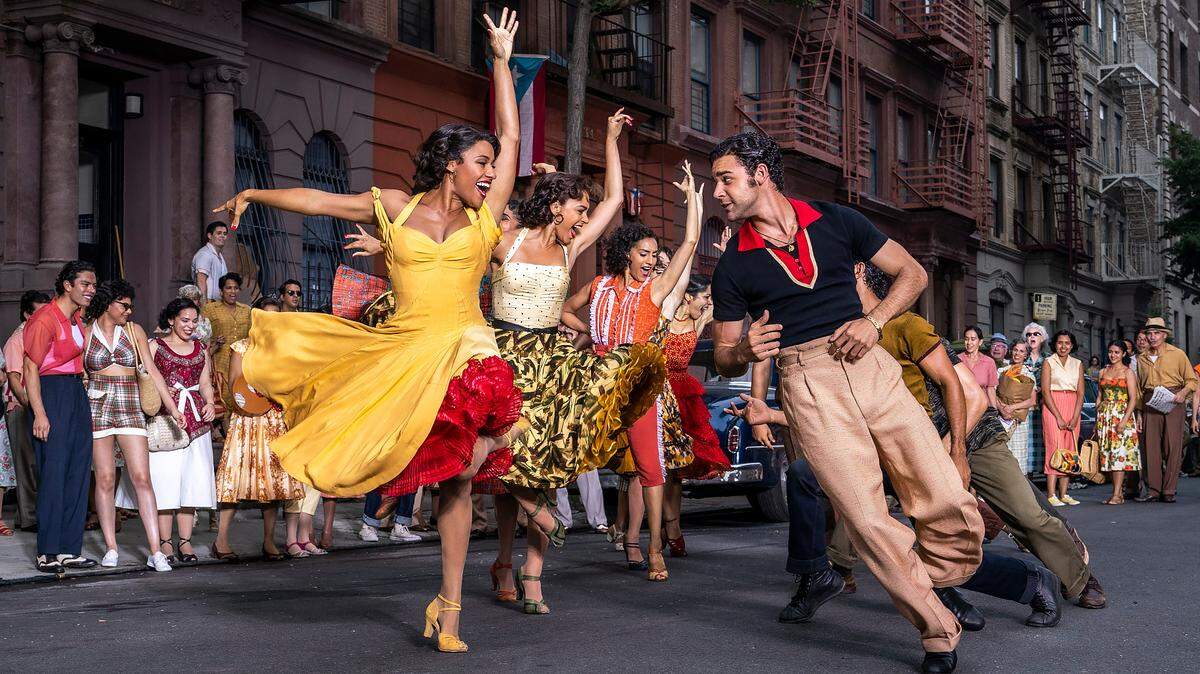This image released by 20th Century Studios shows Ariana DeBose as Anita, foreground left, and David Alvarez as Bernardo in “West Side Story.” (Niko Tavernise/20th Century Studios via AP)