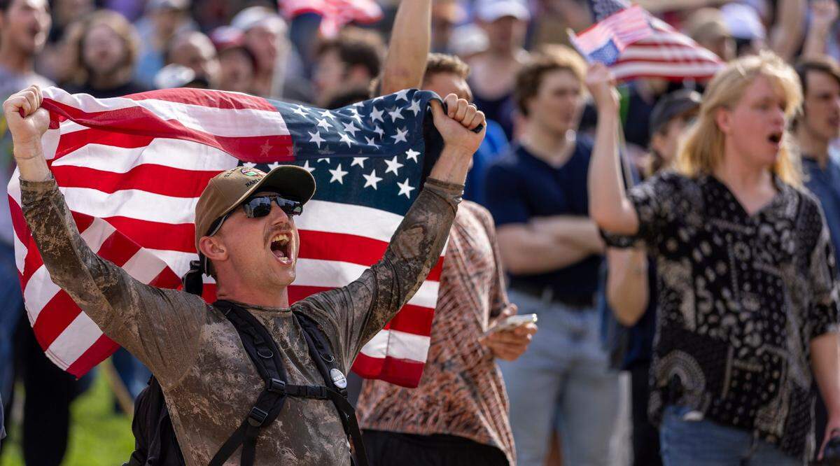 Garrett Brown displays his enthusiasm during the ‘No Kings’ rally at the North Carolina State Capital on Saturday, June 14, 2025 in Raleigh, N.C.