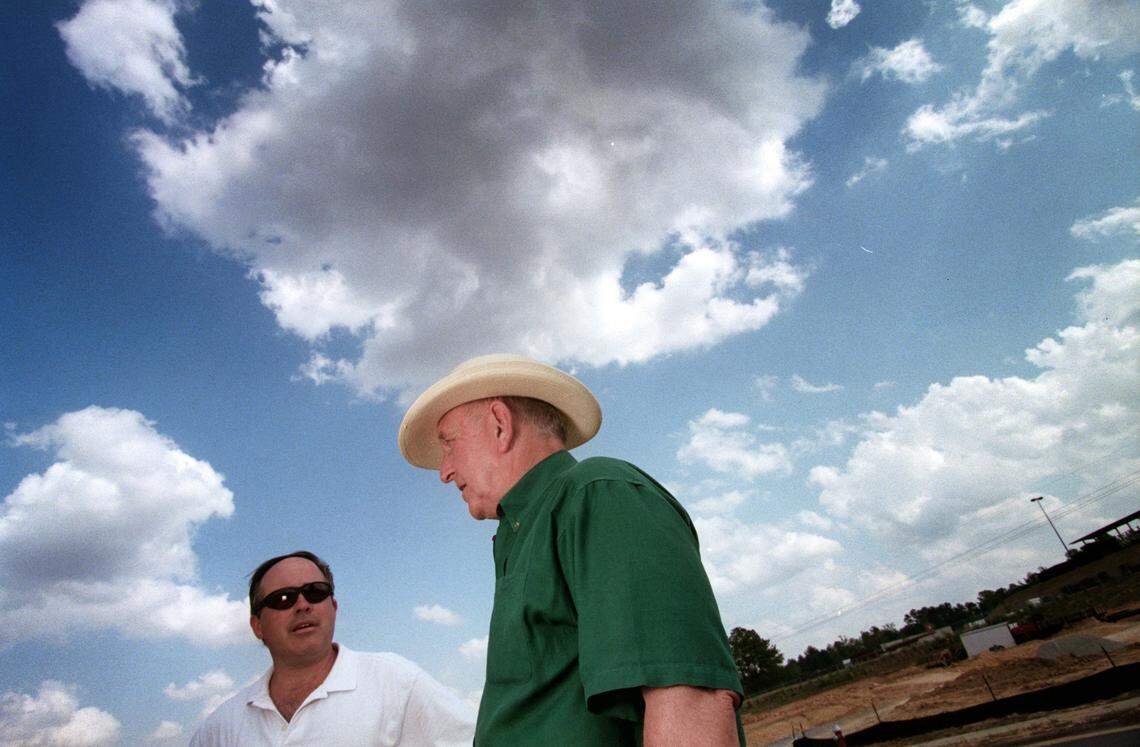 Jud Ammons, right, talks with Duke Finley, president of Finley Commercial Realty about developing a tract of land off New Hope Road in Raleigh in 2001.
