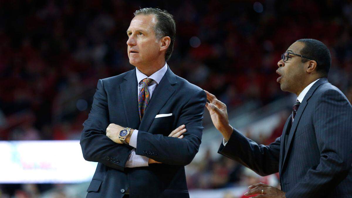 N.C. State coach Mark Gottfried, left, watches the game as assistant coach Orlando Early yells out instructions during the Wolfpack’s 77-73 victory over Boston University at PNC Arena in Raleigh, N.C., Saturday, Dec. 3, 2016.