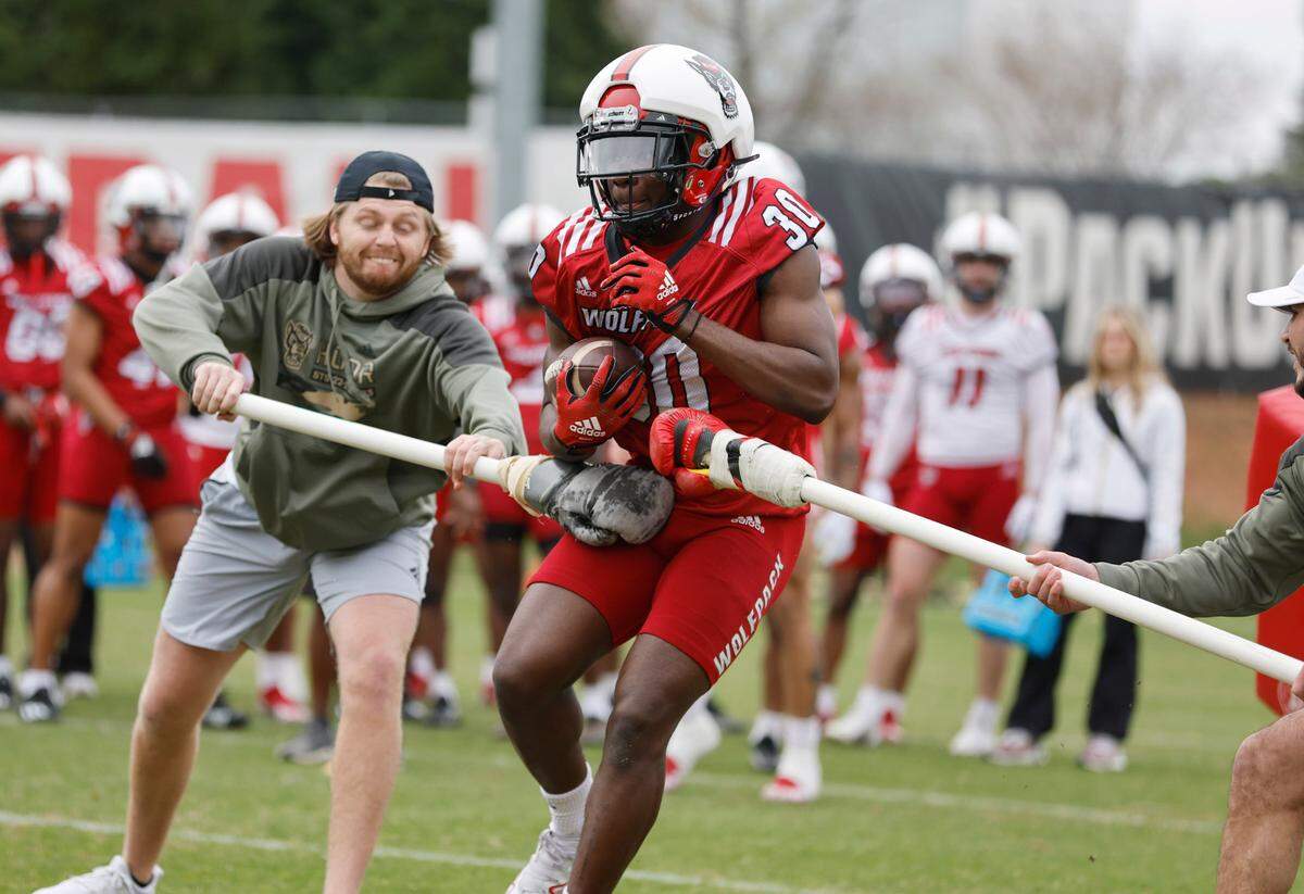 N.C. State running back Kendrick Raphael (30) runs drills during the Wolfpack’s first spring practice in Raleigh, N.C., Wednesday, March 1, 2023.