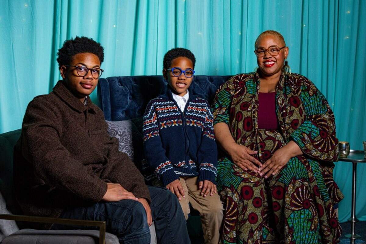 Victoria Scott-Miller and her sons Langston and Emerson prepare to open Liberation Station Bookstore.