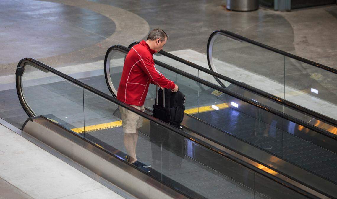 A traveler makes his way towards the parking deck at RDU International Airport in Morrisville, N.C. on Friday, July 9, 2021.