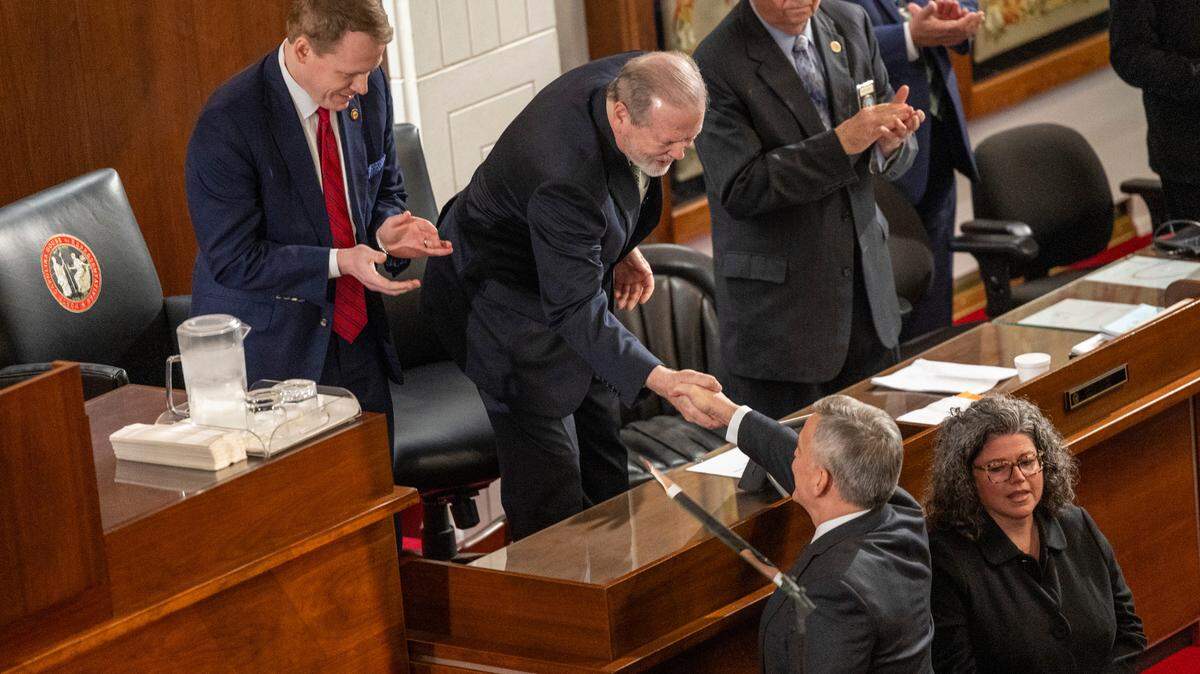 Gov. Josh Stein is greeted by House Speaker Destin Hall, and Senate leader Phil Berger before delivering his State of the State address to a joint session of the General Assembly on Wednesday, March 12, 2025, in the House chamber of the Legislative Building.