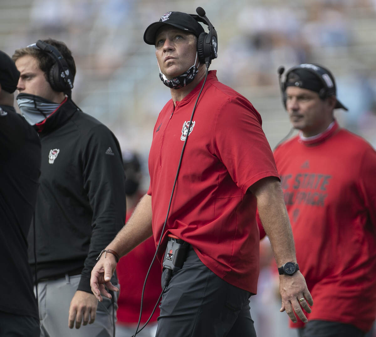 N.C. State coach Dave Doeren checks the scoreboard during a timeout in the second quarter against North Carolina at Kenan Stadium on Saturday, October 24, 2020 in Chapel Hill, N.C.