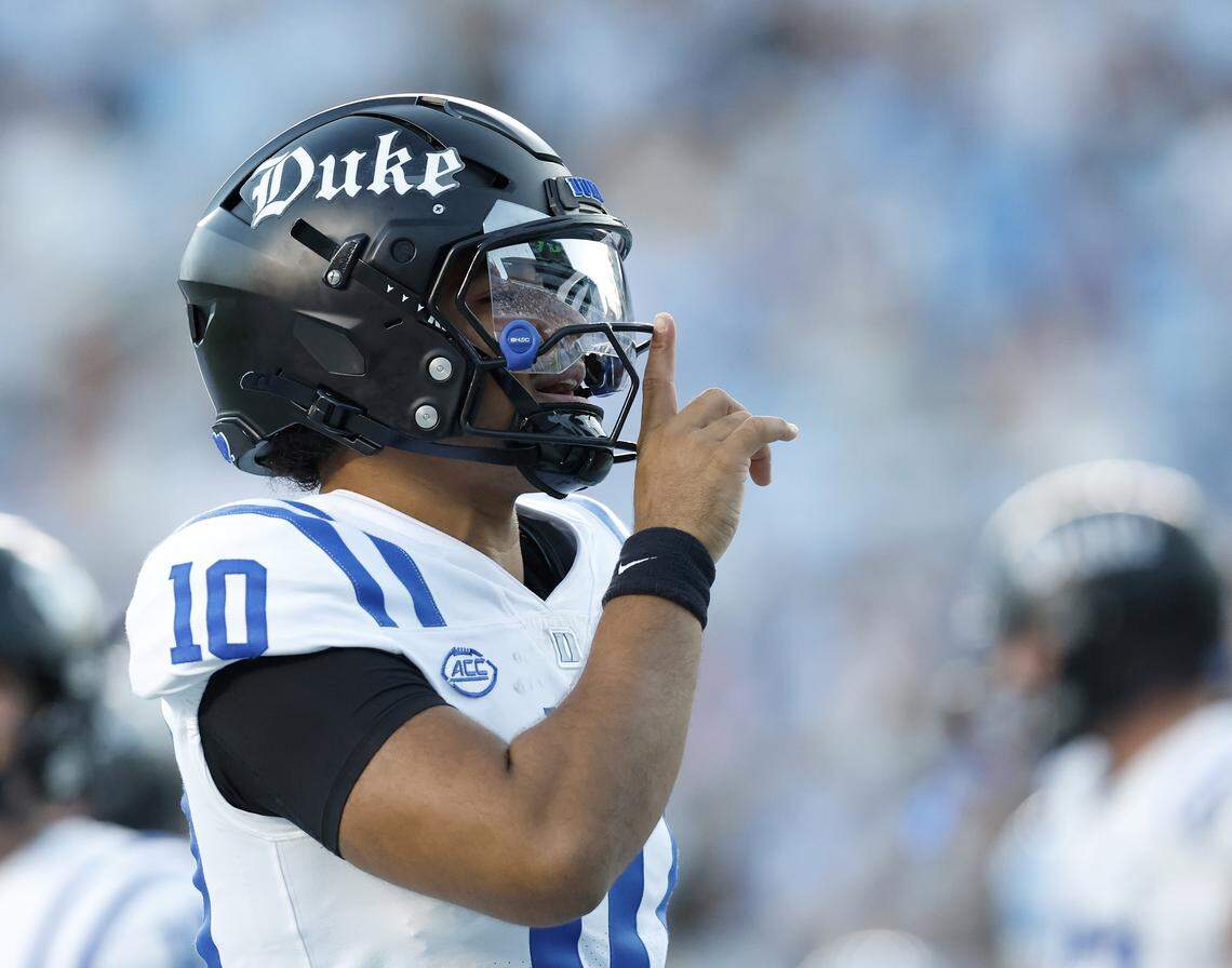 Duke quarterback Darian Mensah motions to the crowd following a Blue Devil touchdown during the first half of the team’s game against North Carolina on Saturday, Nov. 22, 2025, at Kenan Stadium in Chapel Hill, N.C.