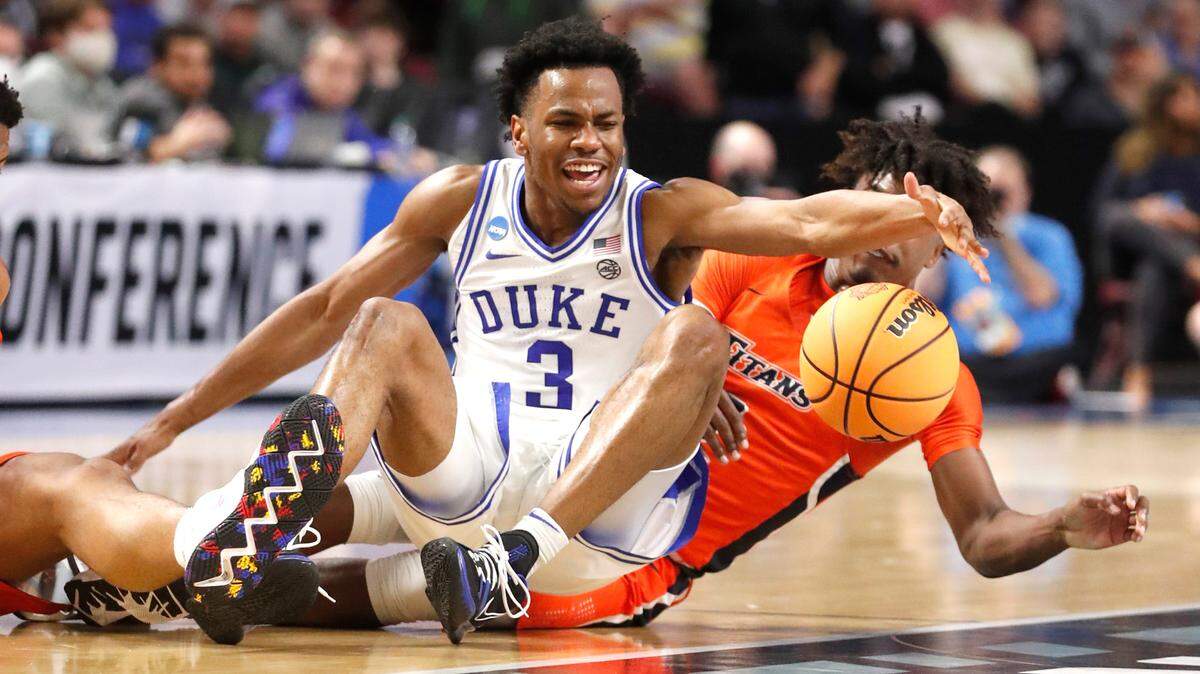 Duke’s Jeremy Roach (3) gets to the loose ball before Cal State Fullerton’s Latrell Wrightsell Jr. (3) during the first half of Duke’s game against Cal State Fullerton in the first round of the NCAA Tournament at Bon Secours Wellness Arena in Greenville, S.C., Friday, March 18, 2022.