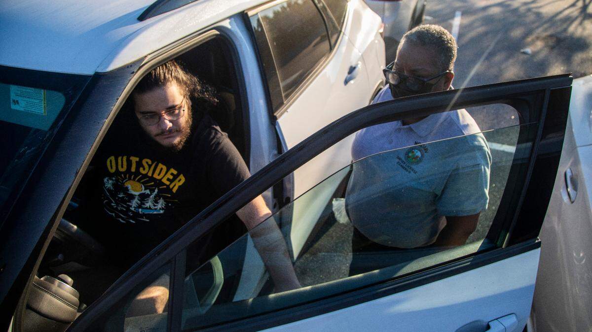 Drivers license examiner Marie Moore performs a safety inspection of Bryan Main’s vehicle prior to a driving test at the NC Division of Motor Vehicles’ West Raleigh Driver License Office Friday morning, Sept. 2, 2022.