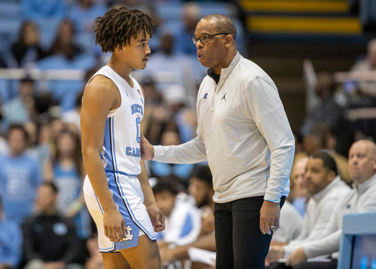 North Carolina coach Hubert Davis talks with Seth Trimble (0) during the first half against Gardner Webb on Tuesday, November 15, 2022 at the Smith Center in Chapel Hill, N.C.