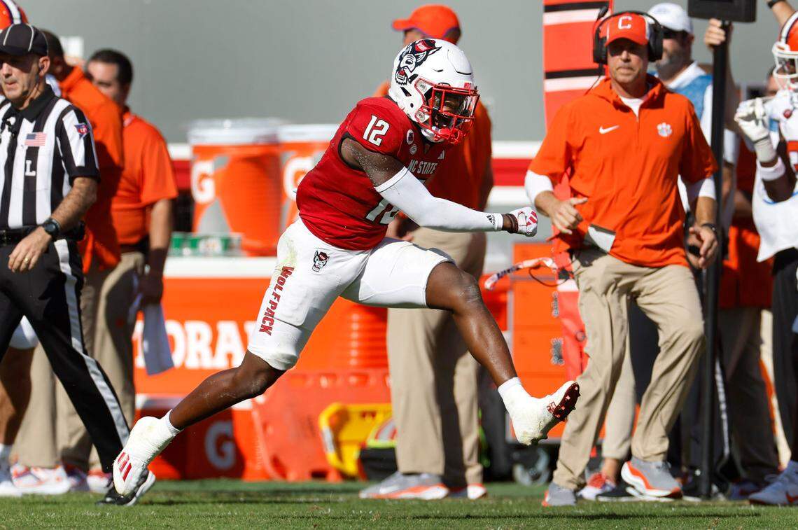 N.C. State defensive back Devan Boykin (12) celebrates stopping Clemson wide receiver Troy Stellato (10) on third down during the first half of N.C. State’s game against Clemson at Carter-Finley Stadium in Raleigh, N.C., Saturday, Oct. 28, 2023.