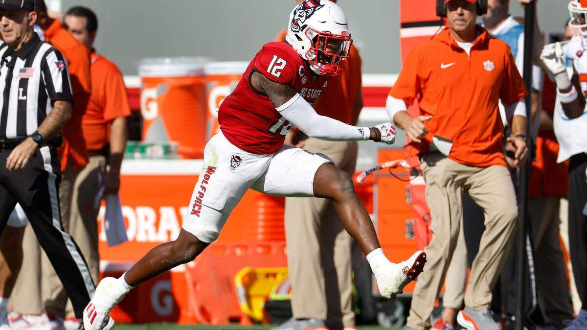 N.C. State defensive back Devan Boykin (12) celebrates stopping Clemson wide receiver Troy Stellato (10) on third down during the first half of N.C. State’s game against Clemson at Carter-Finley Stadium in Raleigh, N.C., Saturday, Oct. 28, 2023.
