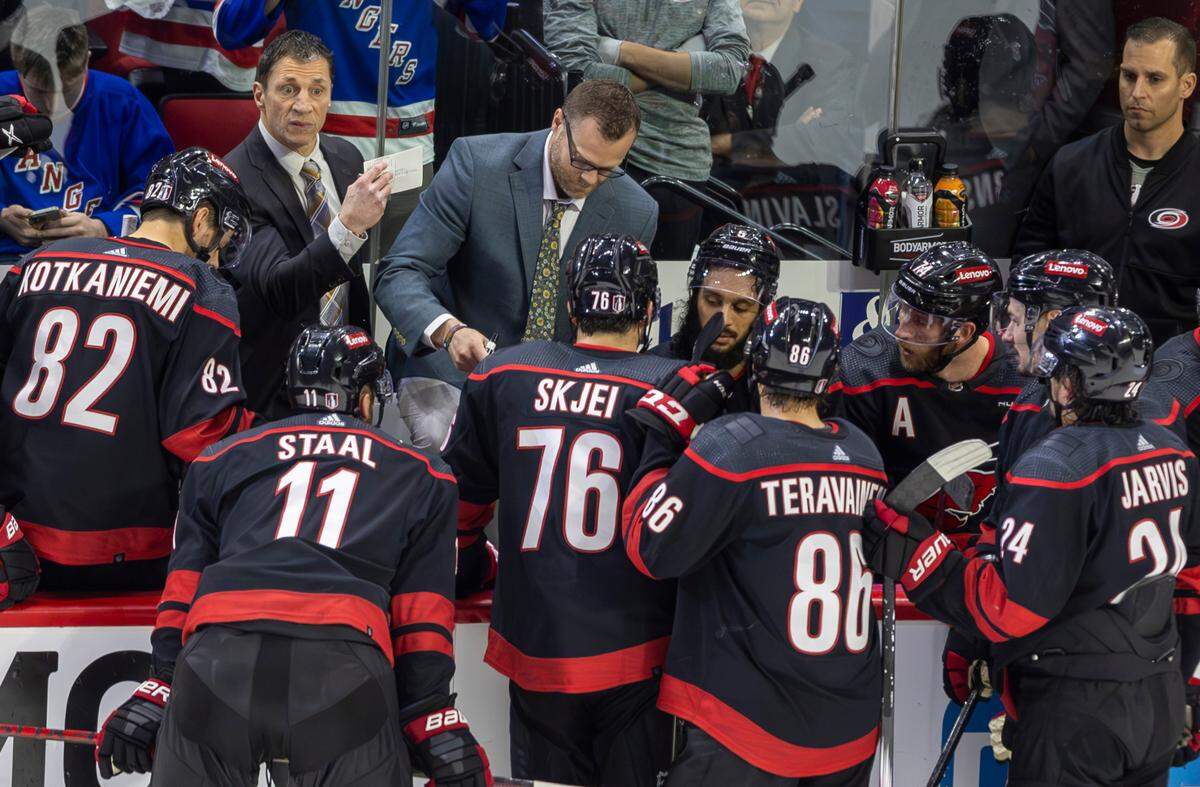 Carolina Hurricanes coach Rod Brind’Amour and assistant coach Tim Gleason work with their players as the New York Ranges pull their goalie in the closing minute of play in Game 4 during the second round of the 2024 Stanley Cup playoffs on Saturday, May 11, 2024 at PNC Arena, in Raleigh N.C.